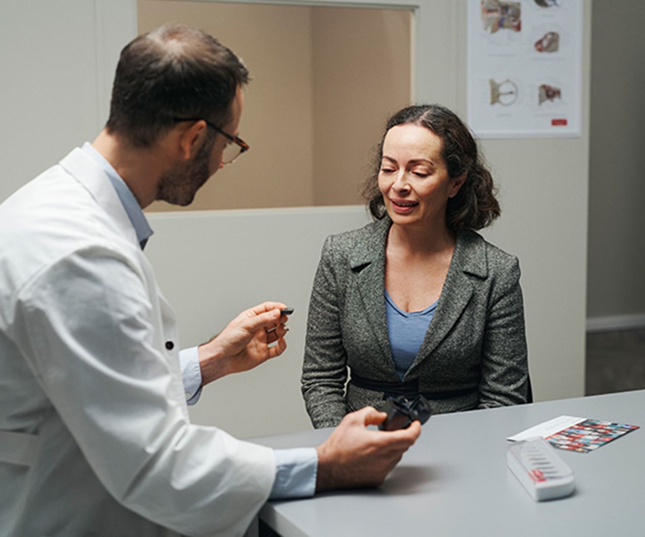 Hearing care professional advising a patient.