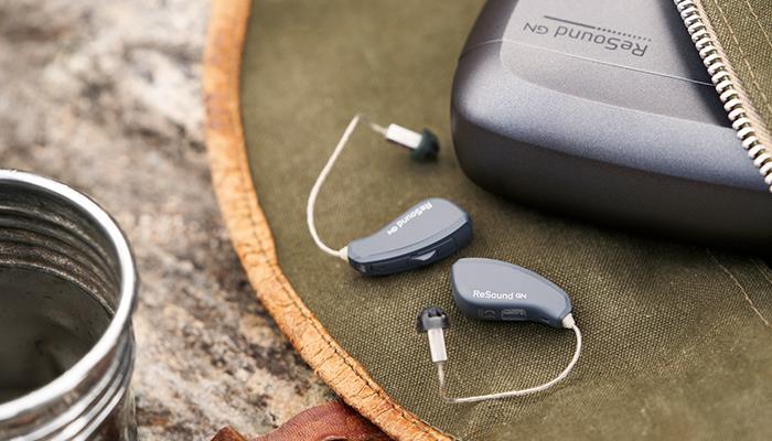 ReSound LiNX Quattro RIE hearing aids and charger in a bag