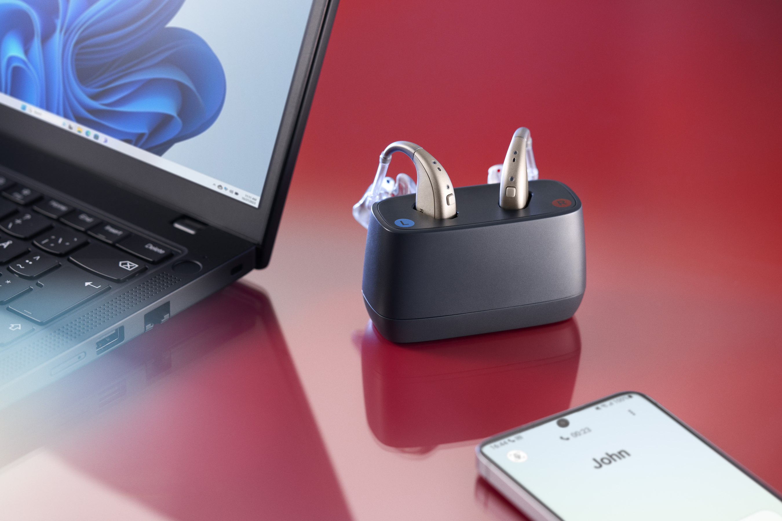 ReSound Enzo IA hearing aids with a MultiConnect device, showcasing enhanced connectivity options.