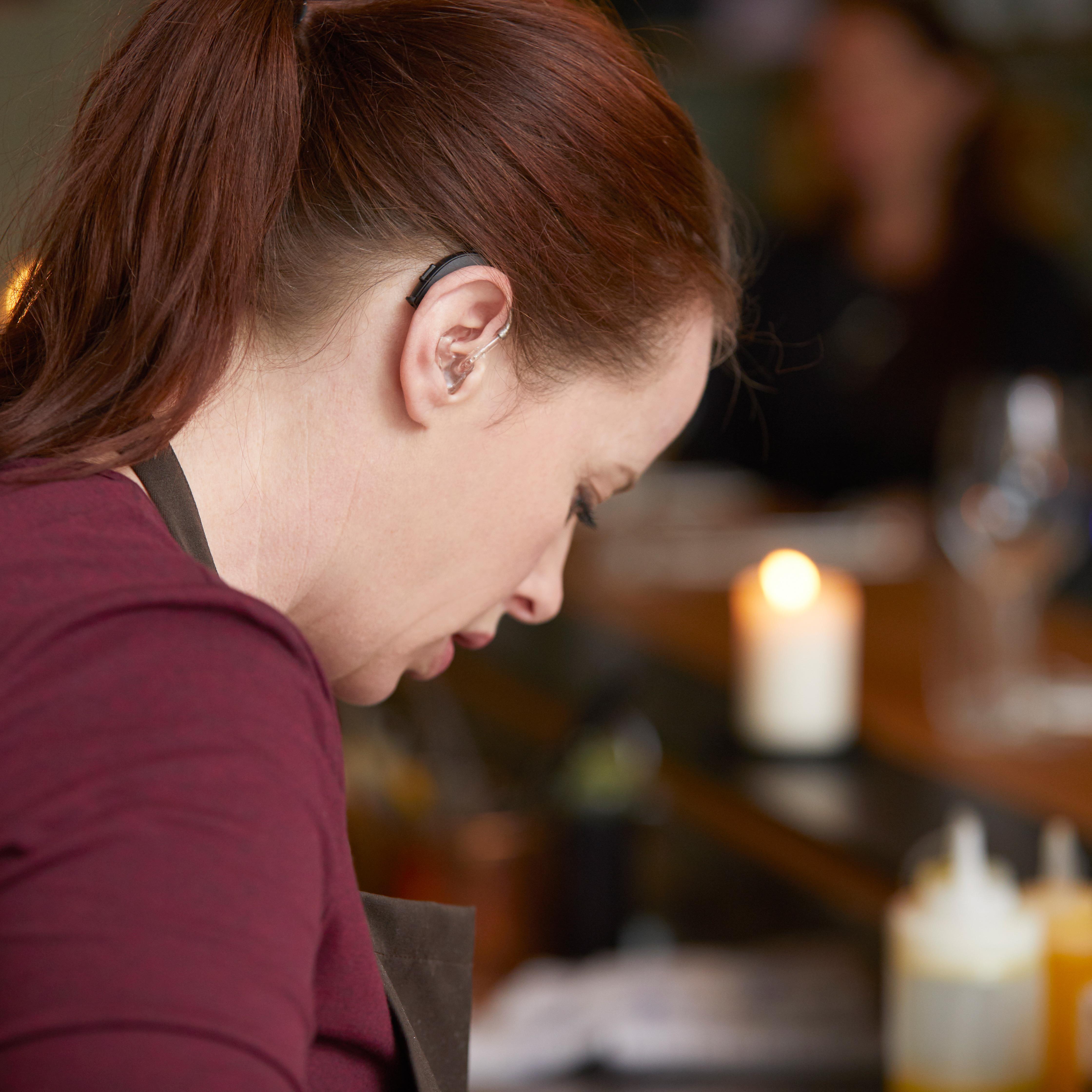 chef wearing resound enzo 3d hearing aids