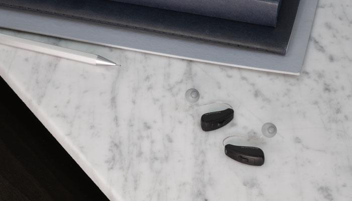 ReSound Key RIE hearing aids on a table