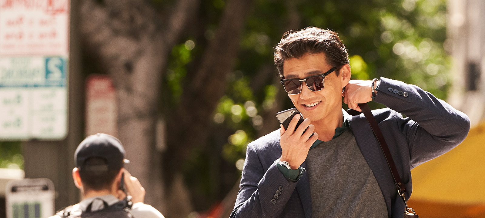 Happy man streams music and phone calls directly to LiNX Quattro rechargeable hearing aids